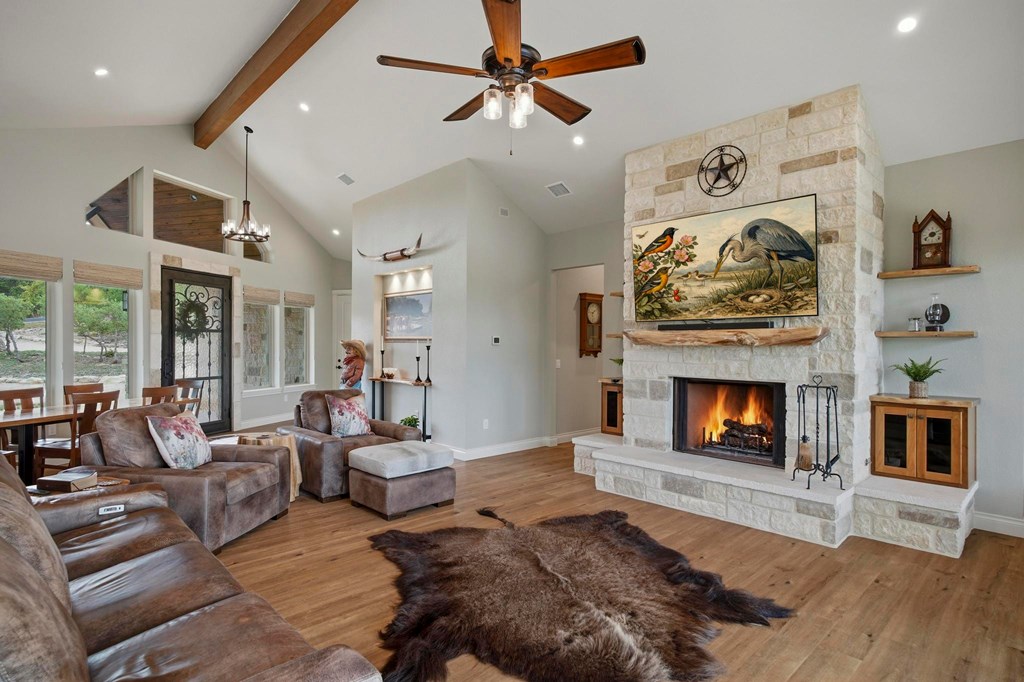 134 North Stallion Ests Drive Spring Branch, TX 78070 - Photo 8 of 67 a living room with furniture and a fireplace