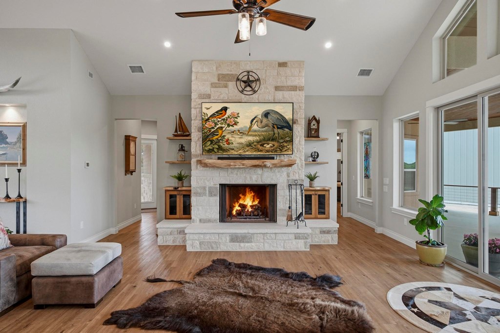 134 North Stallion Ests Drive Spring Branch, TX 78070 - Photo 9 of 67 a living room with furniture and a fireplace