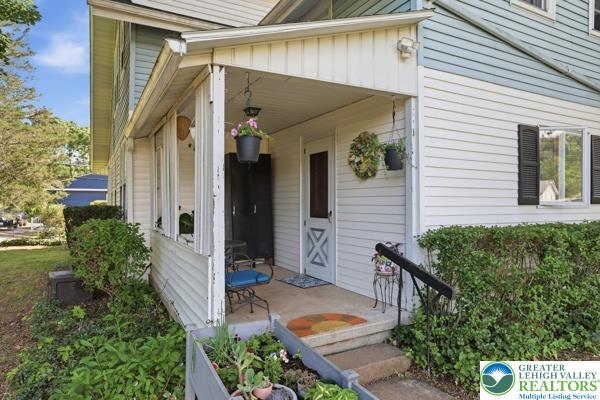 2021 Leithsville Road Hellertown, PA 18055 - Photo 4 of 39 A welcoming covered porch leads to the homes main entryway.
