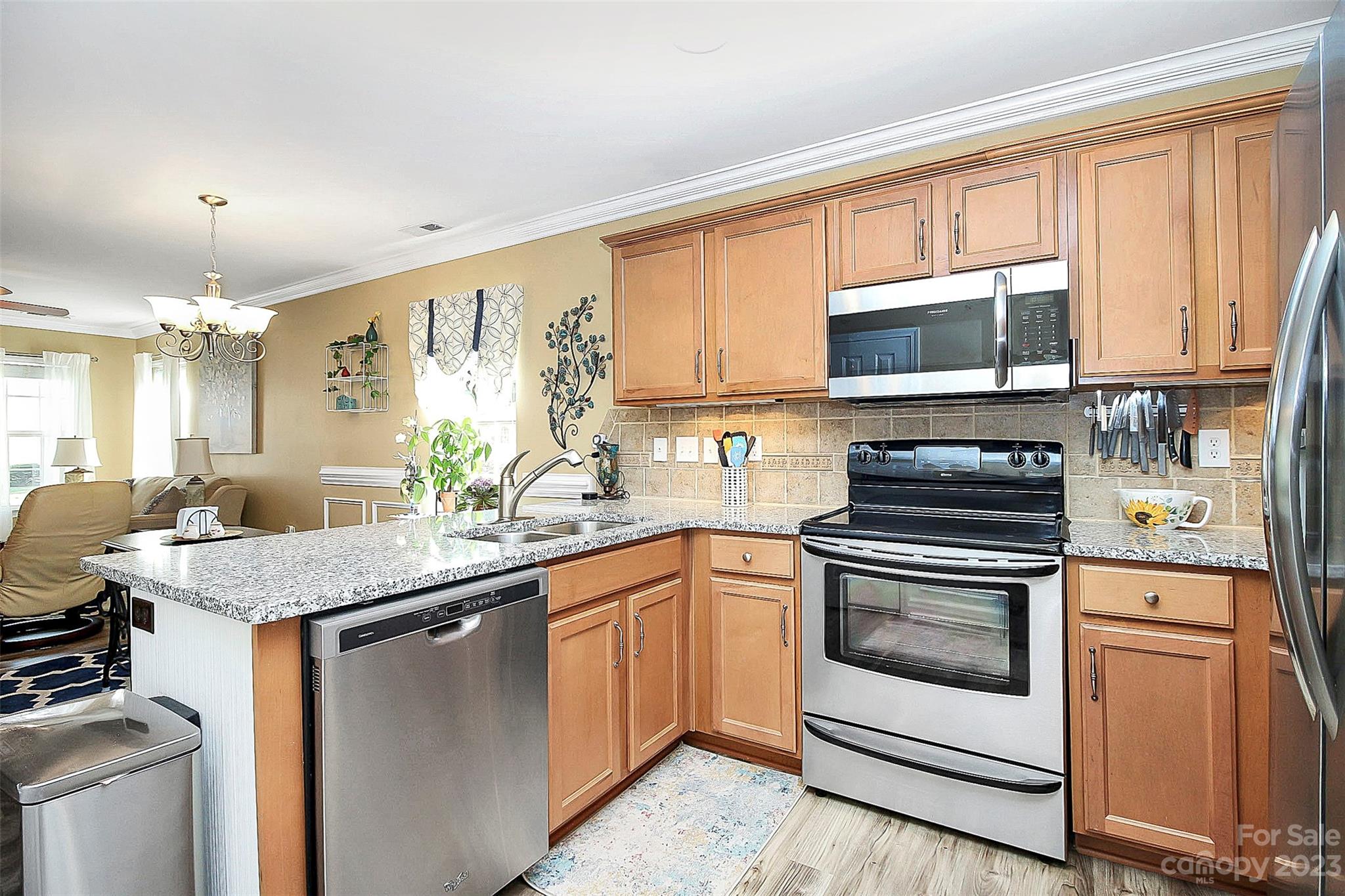 1919 Sandal Brook Road Indian Land, SC 29707 - Photo 14 of 35 a kitchen with stainless steel appliances granite countertop a stove microwave and cabinets