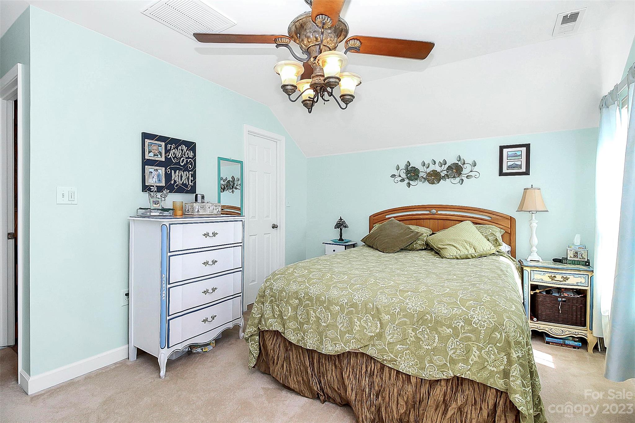 1919 Sandal Brook Road Indian Land, SC 29707 - Photo 25 of 35 a bedroom with a bed and a chandelier