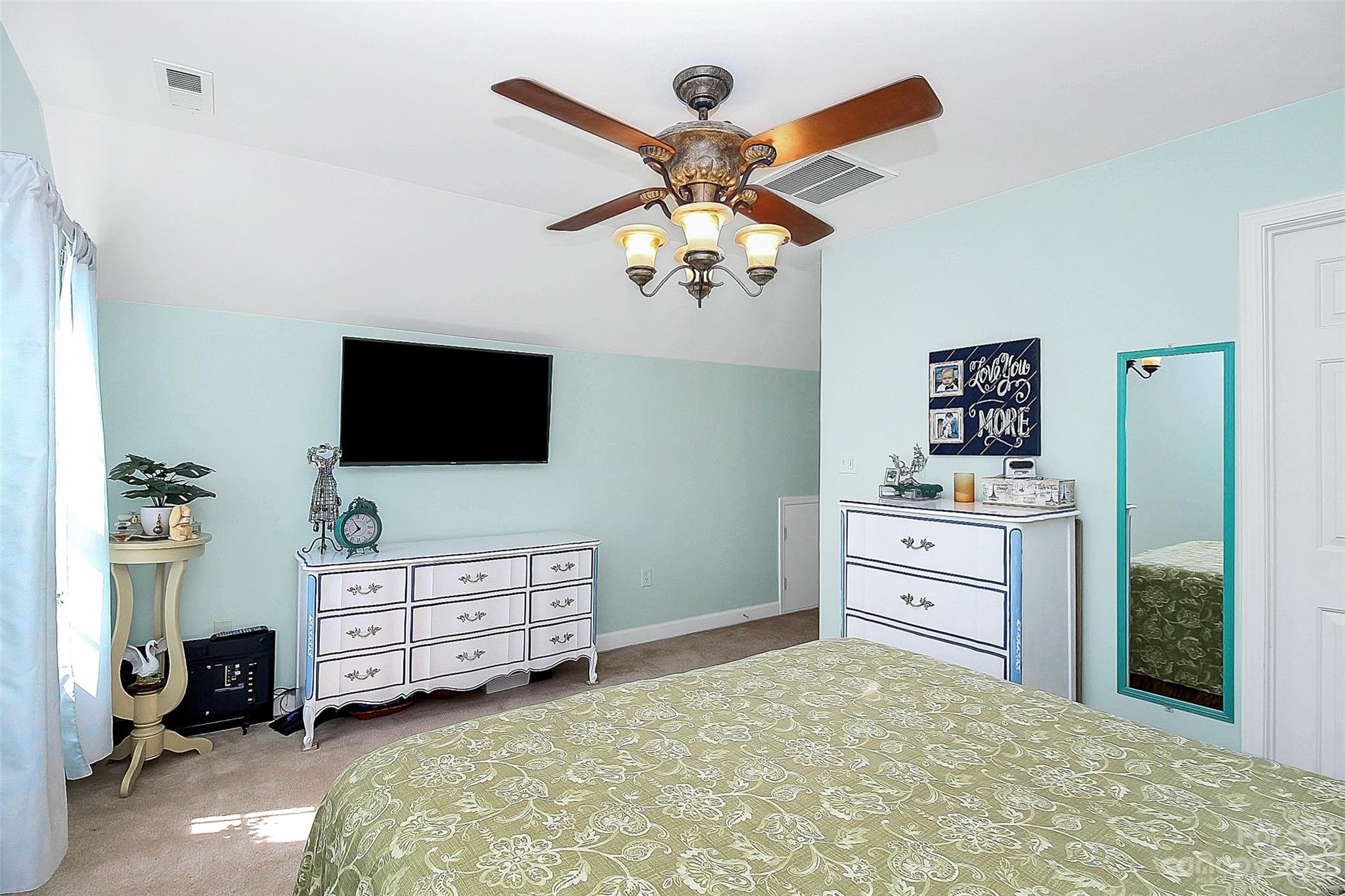 1919 Sandal Brook Road Indian Land, SC 29707 - Photo 26 of 35 a bedroom with a bed and a flat tv screen on dresser