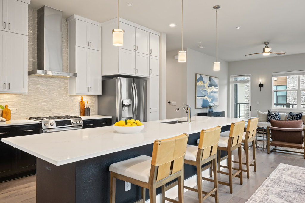 3900 Sightline Street, Unit 127 Austin, TX 78731 - Photo 1 of 39 a kitchen with stainless steel appliances a dining table chairs refrigerator and stove
