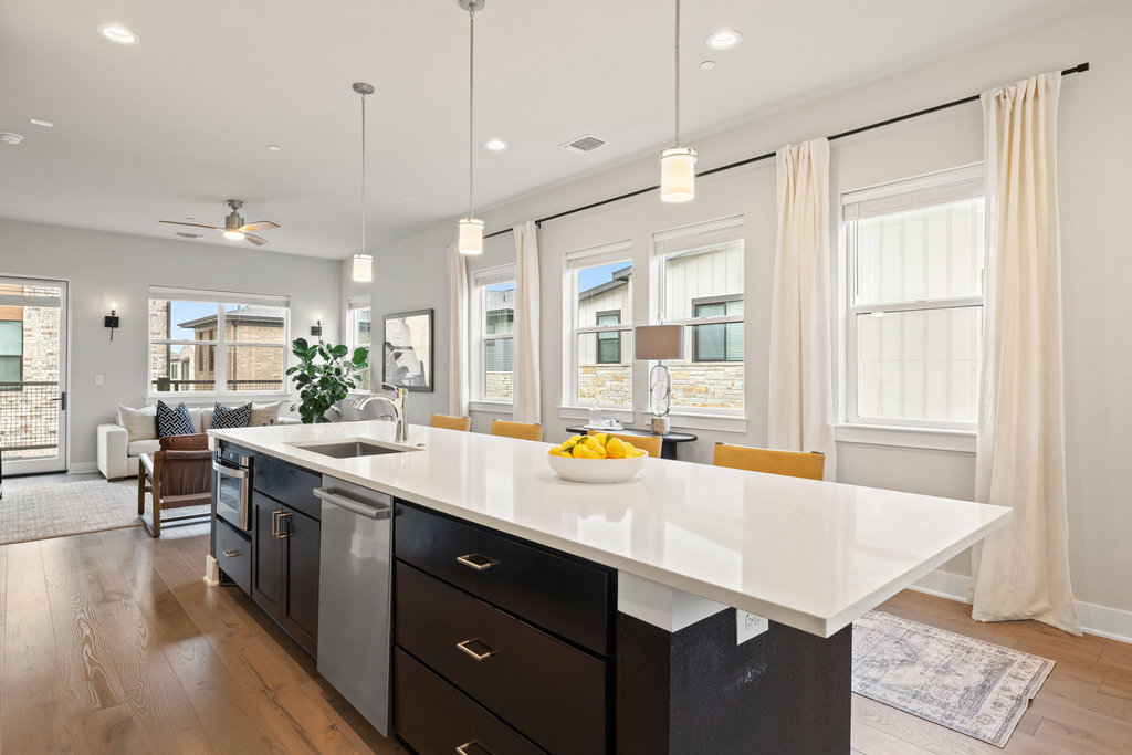 3900 Sightline Street, Unit 127 Austin, TX 78731 - Photo 18 of 39 a large kitchen with a counter space a sink appliances and living room