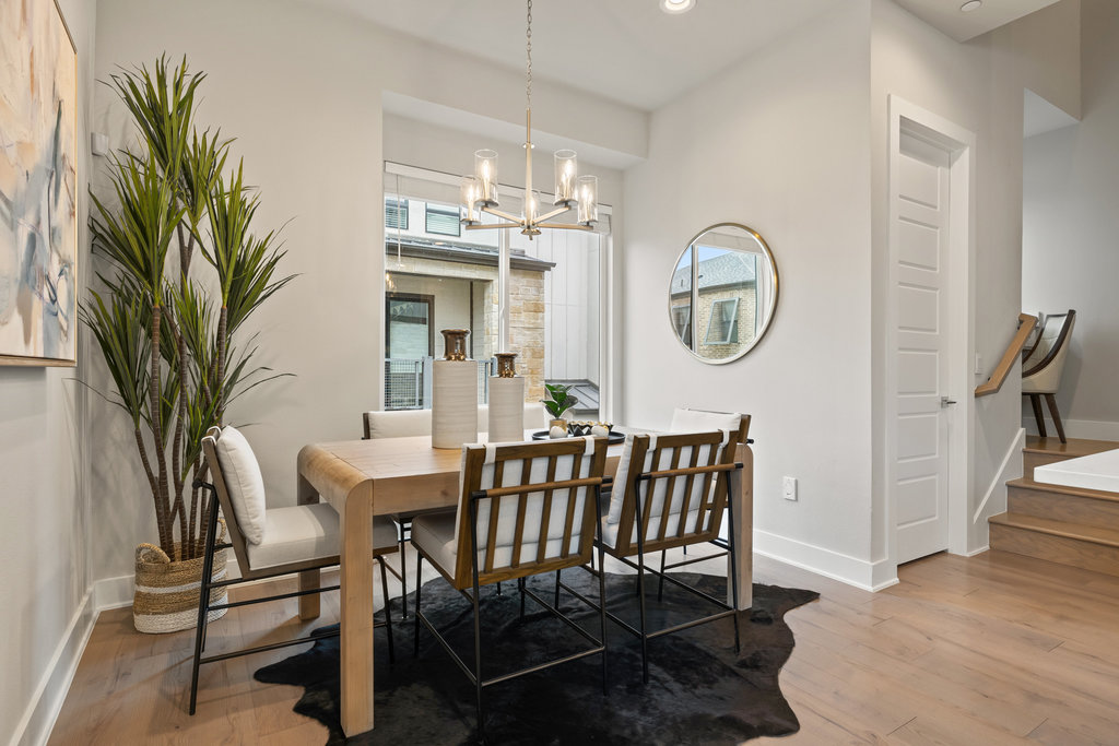 3900 Sightline Street, Unit 127 Austin, TX 78731 - Photo 23 of 39 a view of a dining room with furniture and a chandelier