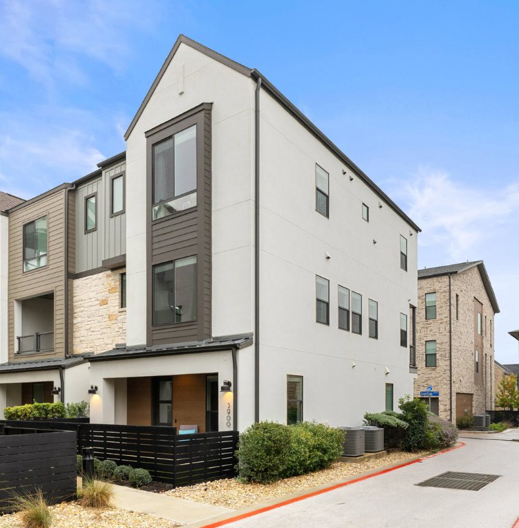 3900 Sightline Street, Unit 127 Austin, TX 78731 - Photo 3 of 39 a front view of a house with balcony