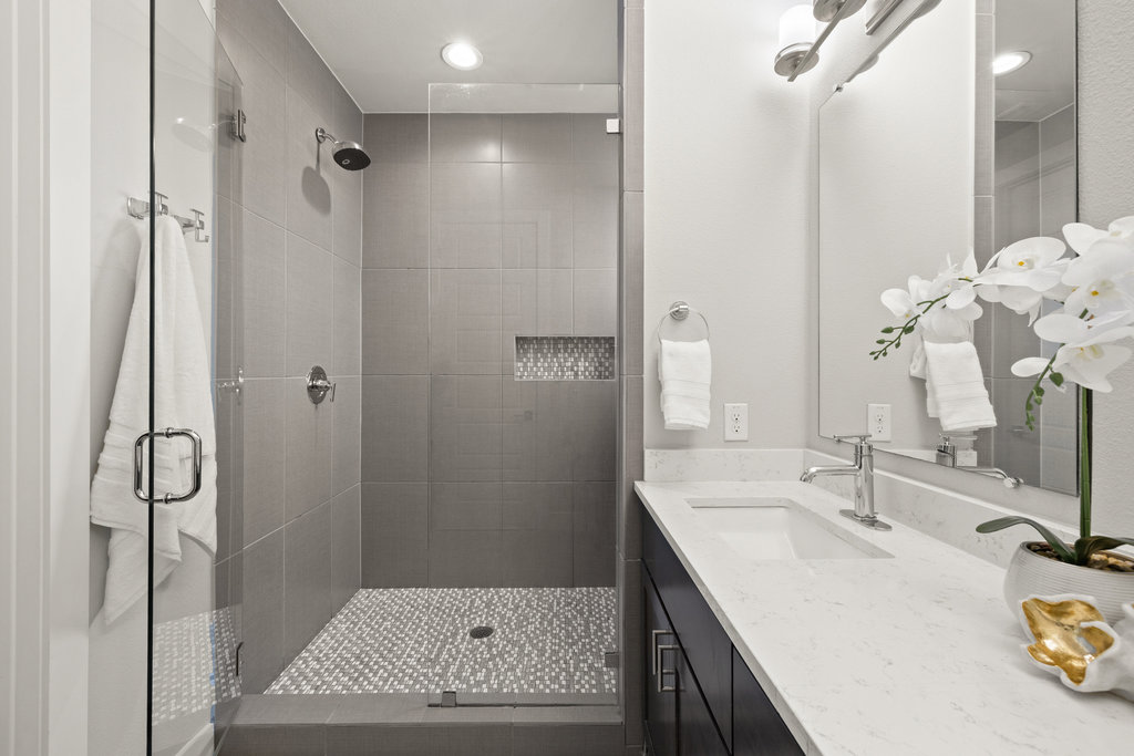 3900 Sightline Street, Unit 127 Austin, TX 78731 - Photo 33 of 39 a bathroom with a sink double vanity and shower