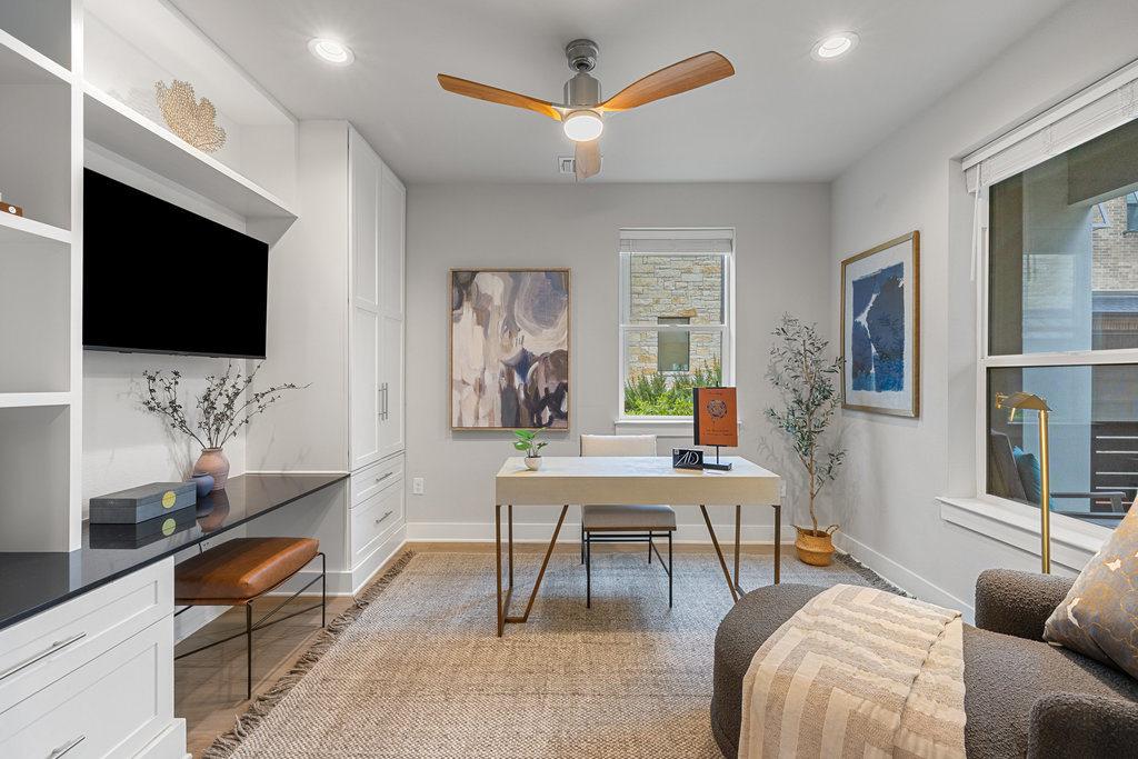 3900 Sightline Street, Unit 127 Austin, TX 78731 - Photo 7 of 39 a living room with furniture and a flat screen tv