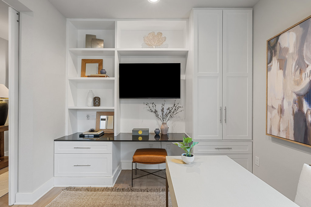 3900 Sightline Street, Unit 127 Austin, TX 78731 - Photo 8 of 39 a living room with fireplace furniture and a flat screen tv