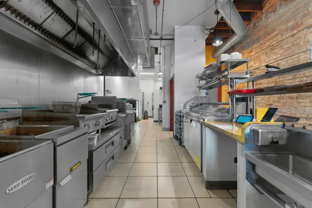 a kitchen with stainless steel appliances granite countertop a sink and cabinets