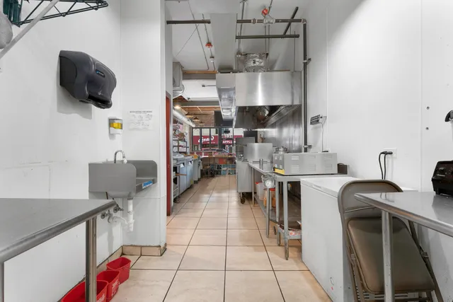 a utility room with sink dryer and washer