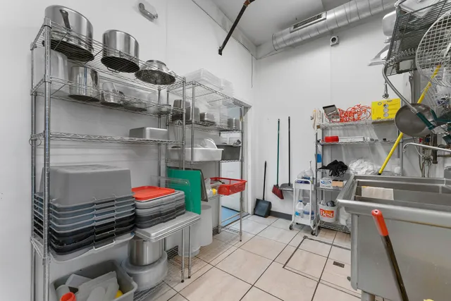 a area with furniture a rug and a shower