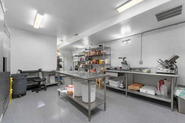 a view of an empty room with windows