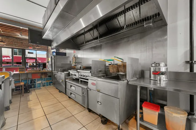 a kitchen with a sink and cabinets
