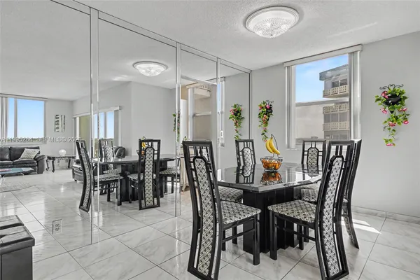 a view of a dining room with furniture and window