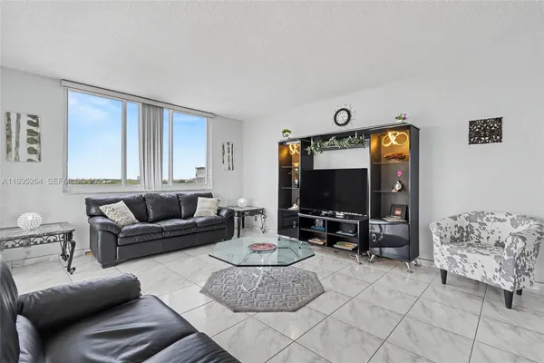 a kitchen with stainless steel appliances kitchen island granite countertop a table and chairs