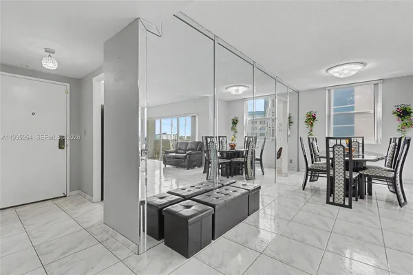 a kitchen with white cabinets and appliances