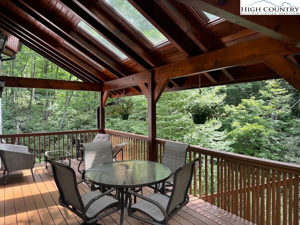 567 Locust Road Newland, NC 28657 - Photo 23 of 28 a view of porch with a table and chairs