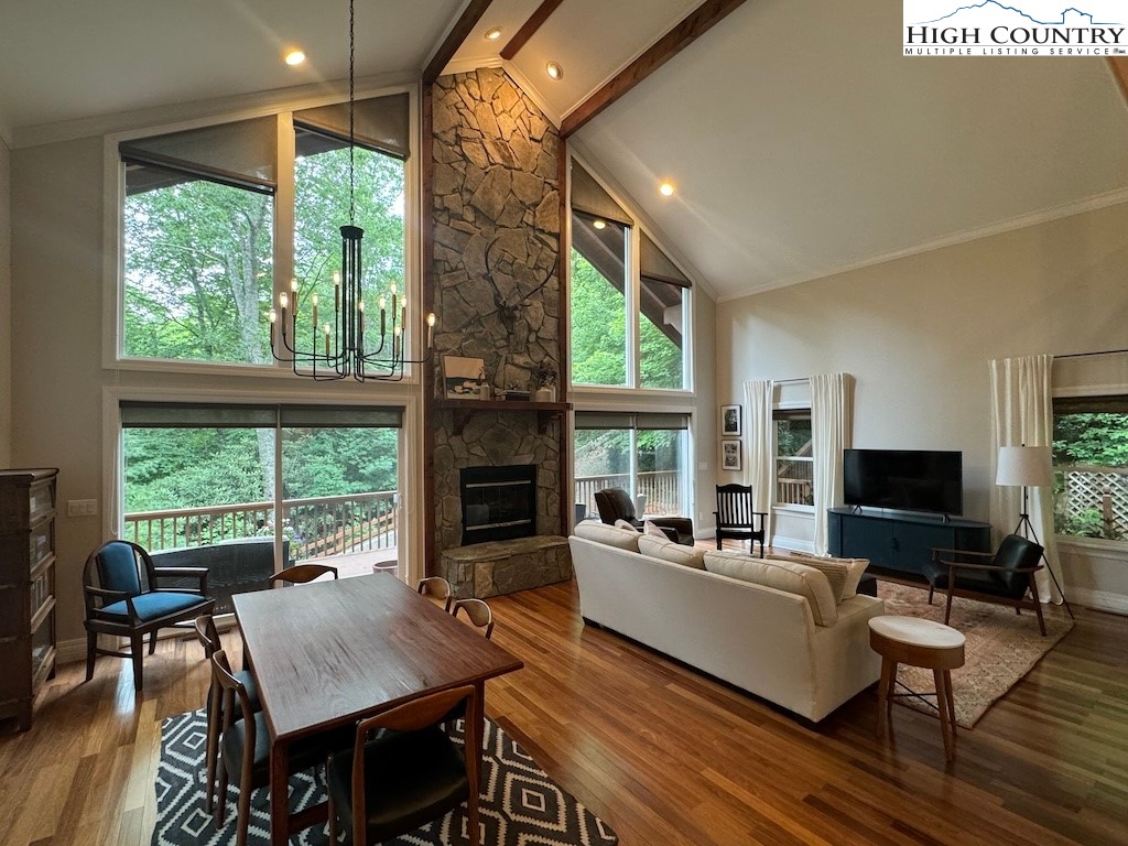 567 Locust Road Newland, NC 28657 - Photo 3 of 28 a living room with furniture a flat screen tv and a fireplace