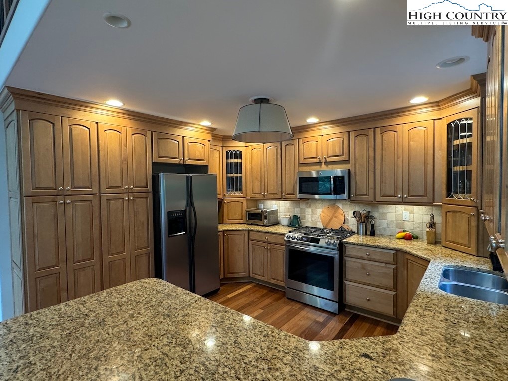 567 Locust Road Newland, NC 28657 - Photo 7 of 28 a kitchen with stainless steel appliances granite countertop a refrigerator and a sink