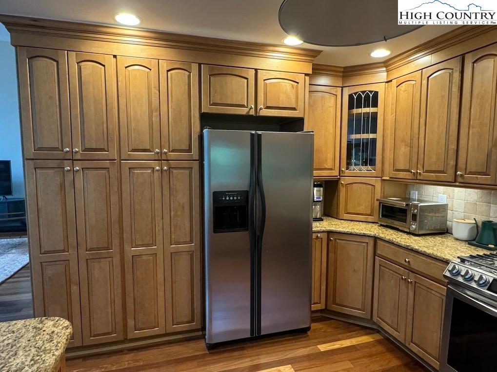 567 Locust Road Newland, NC 28657 - Photo 8 of 28 a kitchen with stainless steel appliances granite countertop a refrigerator and a sink