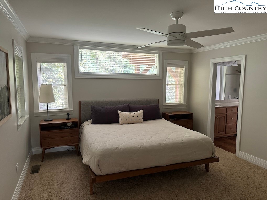 567 Locust Road Newland, NC 28657 - Photo 10 of 28 a bedroom with a bed and a window