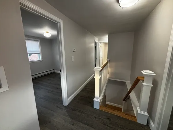 a view of entryway with wooden floor