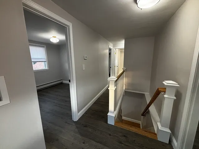 a view of entryway with wooden floor
