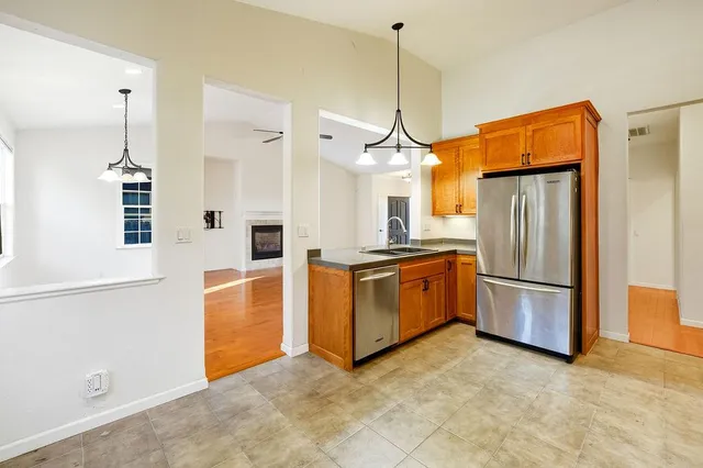 a kitchen with a sink cabinets and window