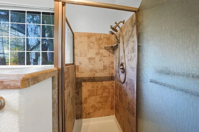 a bathroom with a tub and shower