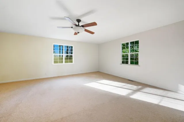 a view of empty room with windows
