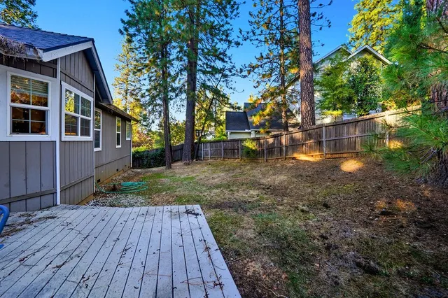 a view of a backyard with sitting area