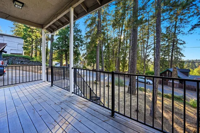 a view of porch with wooden floor