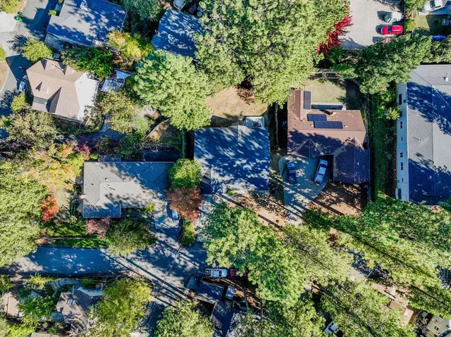 wooden floor fireplace and windows in an empty room