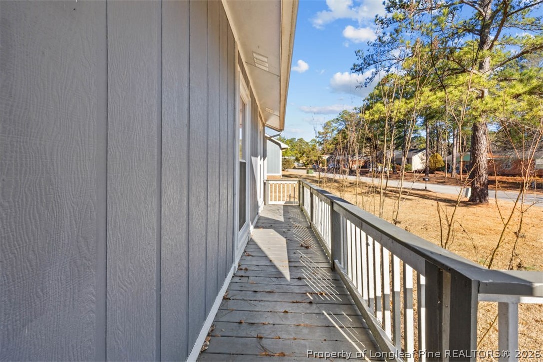 3305 Hunting Bay Drive Spring Lake, NC 28390 - Photo 5 of 27 a view of a balcony with wooden floor and fence