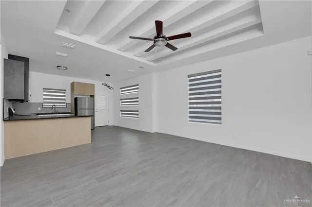 a view of a kitchen with a sink and dishwasher kitchen appliances