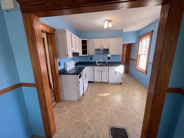 15 Wrentham Road Worcester, MA 01602 - Photo 6 of 16 a large white kitchen with sink refrigerator and window