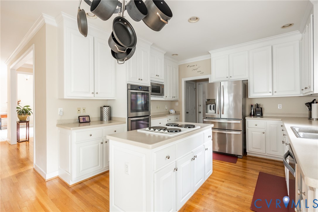 13902 Summersedge Terrace Chesterfield, VA 23832 - Photo 13 of 30 a kitchen with stainless steel appliances granite countertop a refrigerator a stove top oven a sink and dishwasher