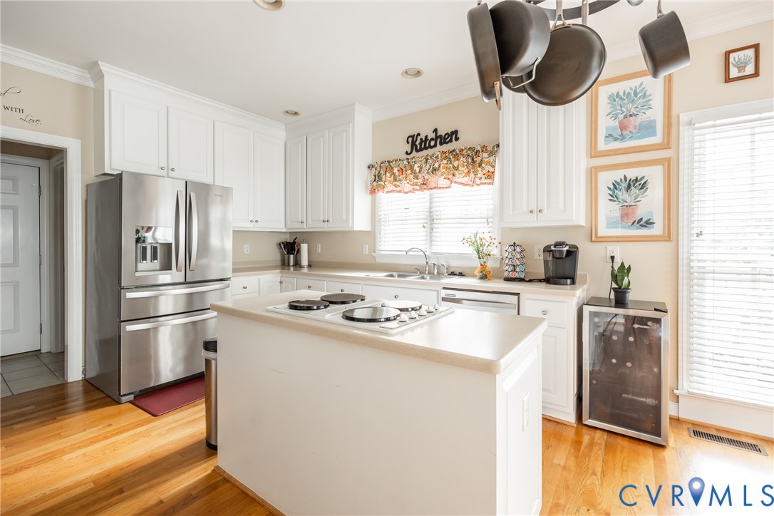 13902 Summersedge Terrace Chesterfield, VA 23832 - Photo 14 of 30 a kitchen with a sink a stove a refrigerator and a window