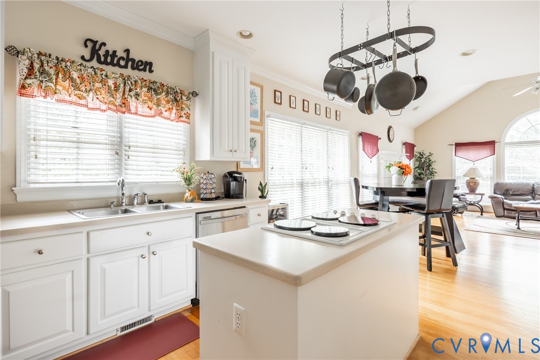 13902 Summersedge Terrace Chesterfield, VA 23832 - Photo 15 of 30 a kitchen with a sink a stove a dining table and chairs