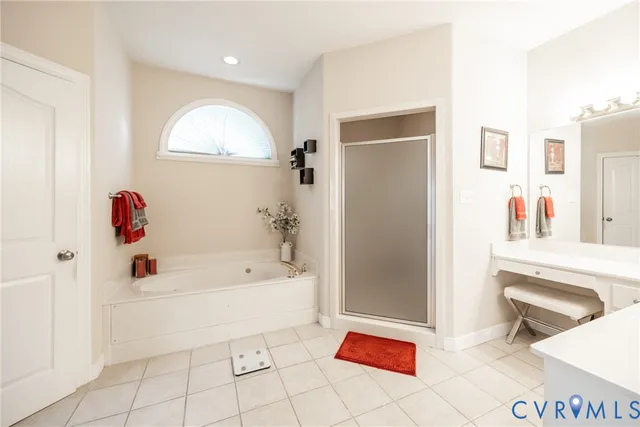 a bathroom with a bathtub and a sink