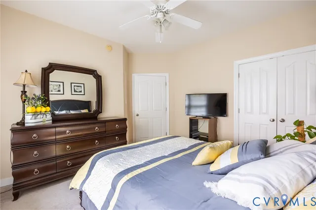 a bedroom with a bed and a couch