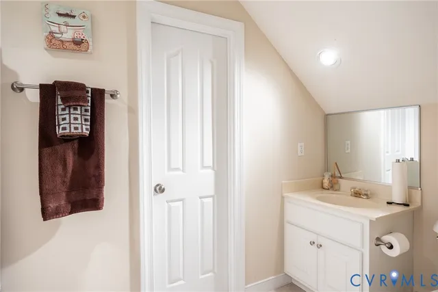 a bathroom with a sink a mirror and a shower