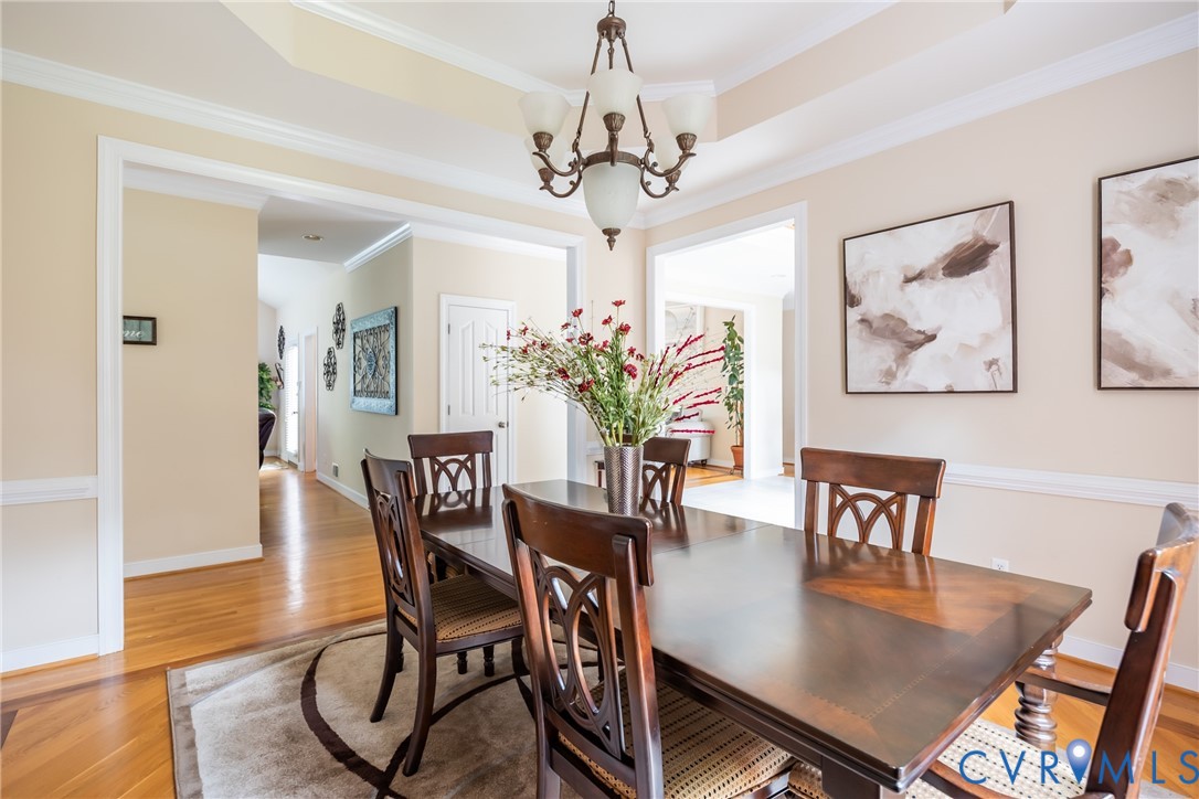 13902 Summersedge Terrace Chesterfield, VA 23832 - Photo 6 of 30 a view of a dining room with furniture wooden floor and a chandelier