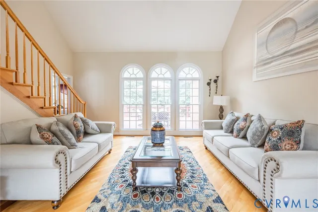 a living room with furniture or couch and a large window