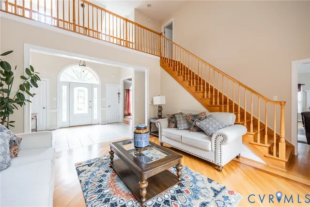 a living room with furniture or couch and a rug
