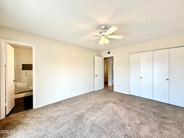 a view of an empty room with a bathroom