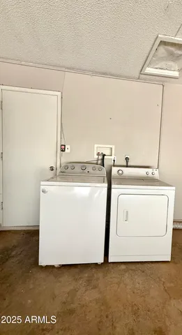 a utility room with washer and dryer