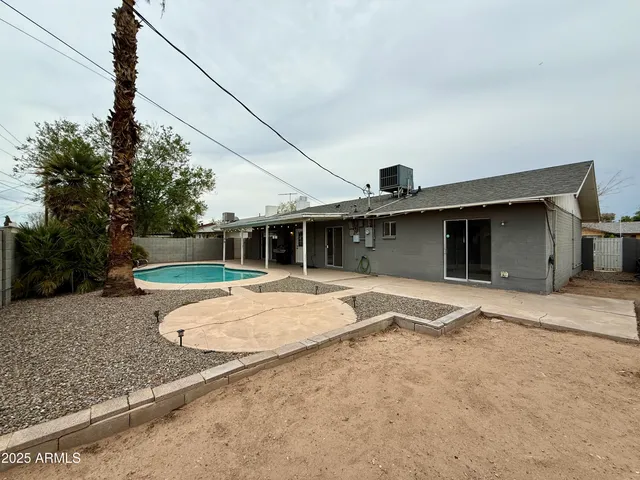 a view of a house with a yard and garage