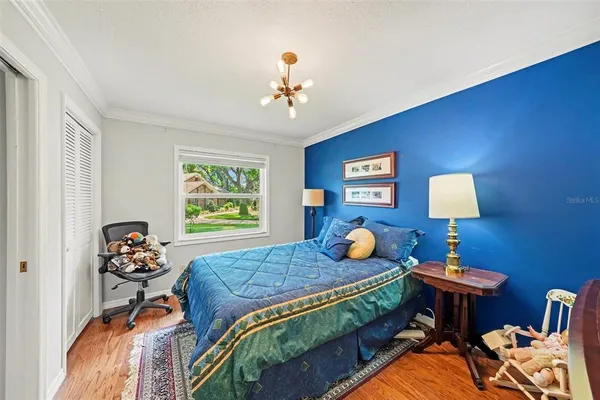a bedroom with bed and a window